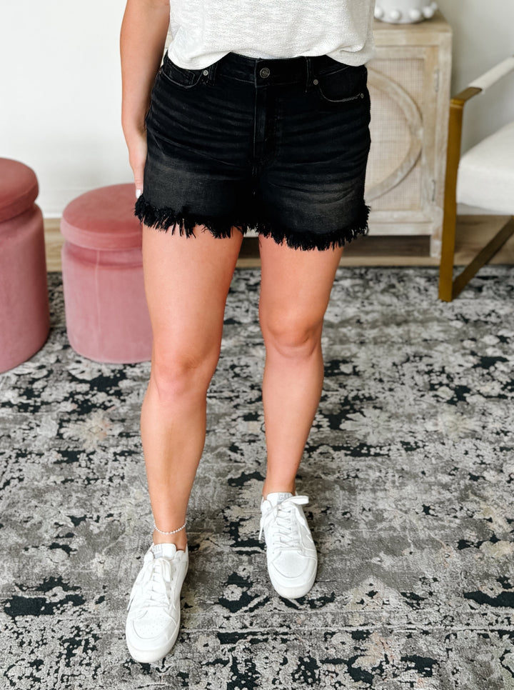 Mid Rise Frayed Hem Denim Shorts in Black
