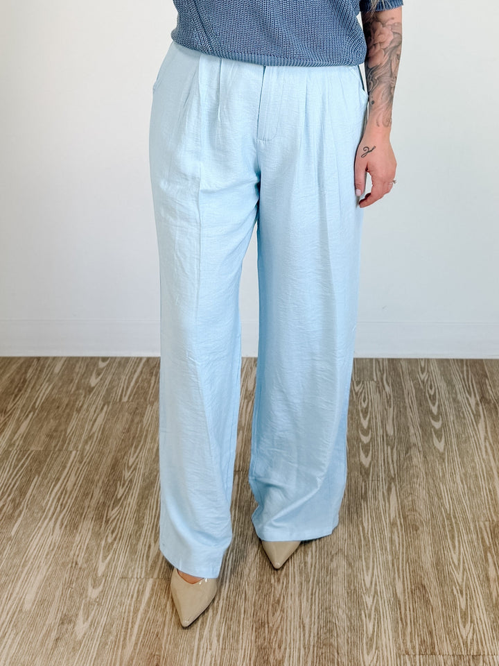 Elegant high-waisted, wide-flowing trousers in blue