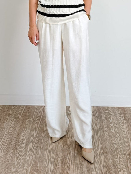 Elegant high-waisted, wide-flowing trousers in off-white